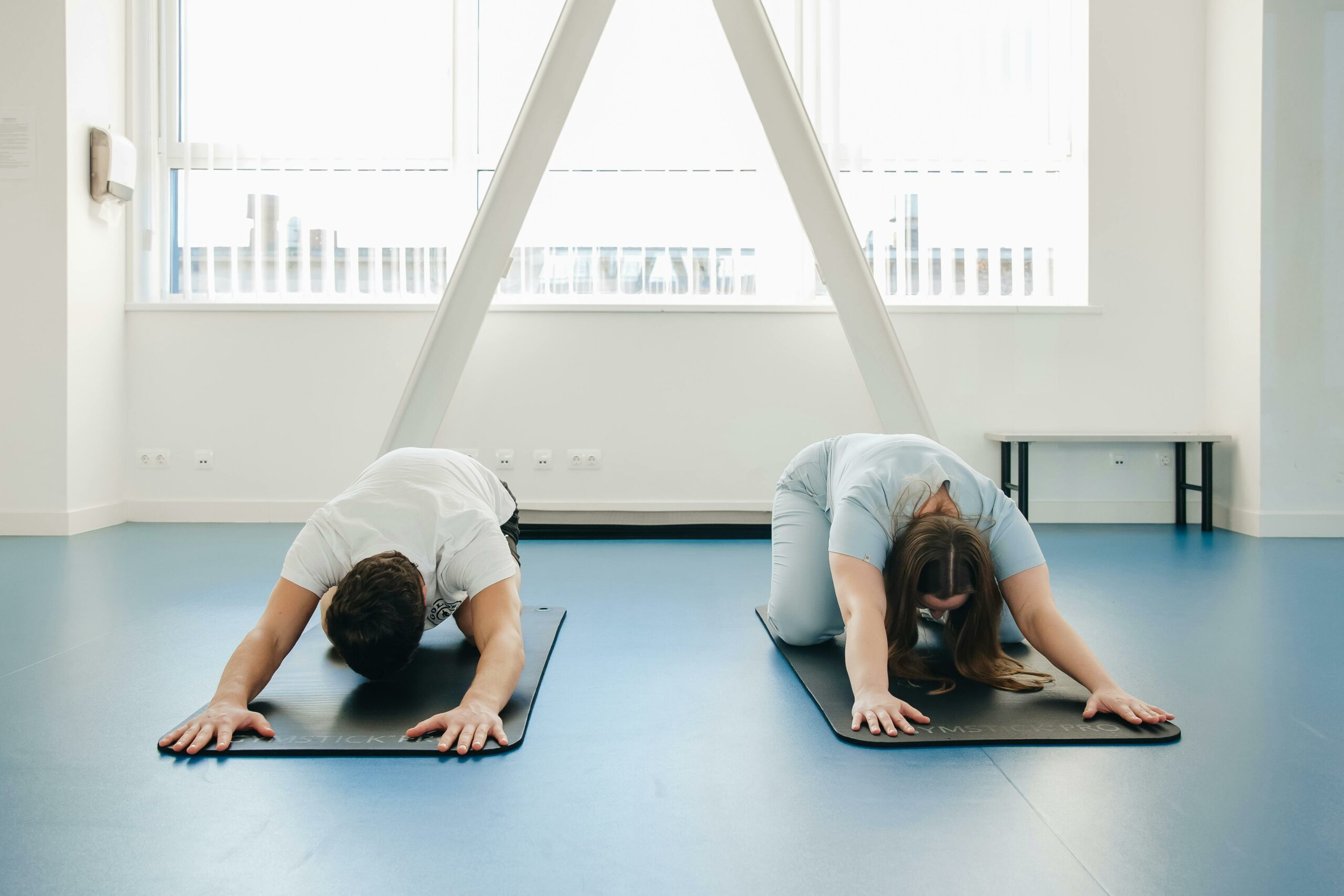 Person doing Pilates stretches to counteract device and screen use